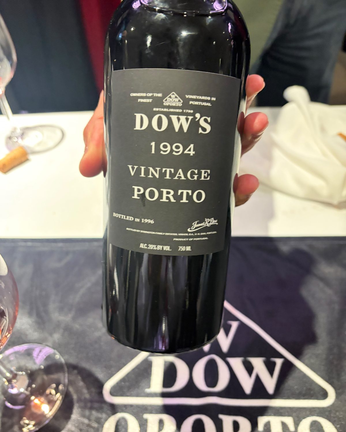 A bottle of Dow's 1994 Vintage Porto held up at the tasting table